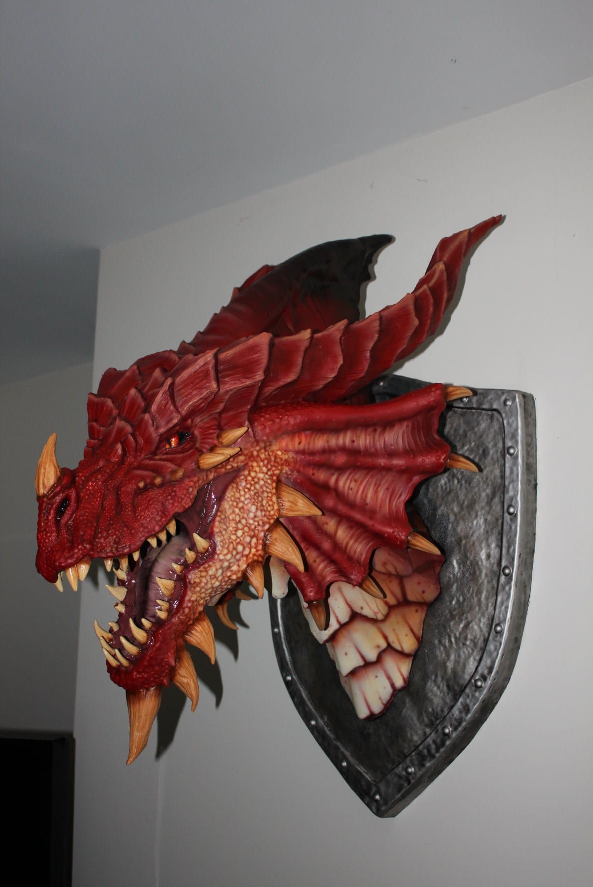 The majestic restoration of this red dragon's mounted head