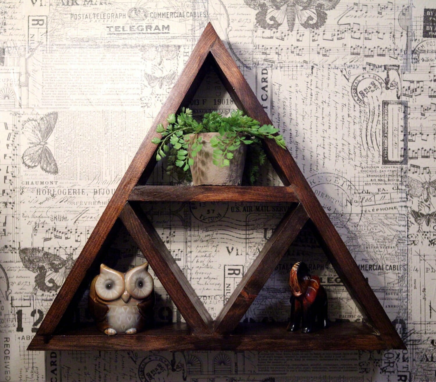 A rustic Zelda Triforce shelf
