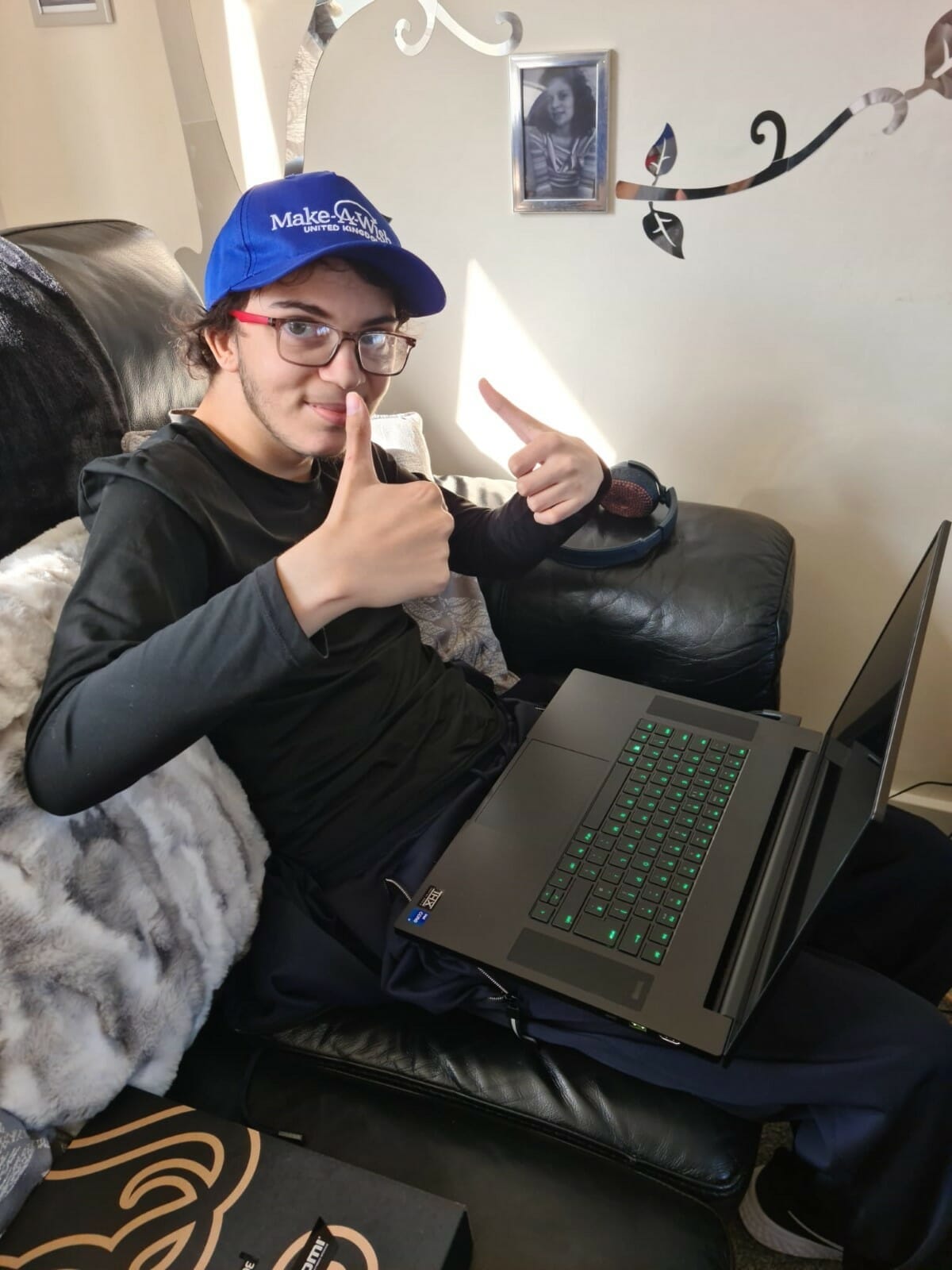 Isaac's gaming PC (which is a laptop) and Isaac with the thumbsup