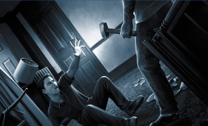 Black and white: man on the ground defends himself from hammer wielding intruder