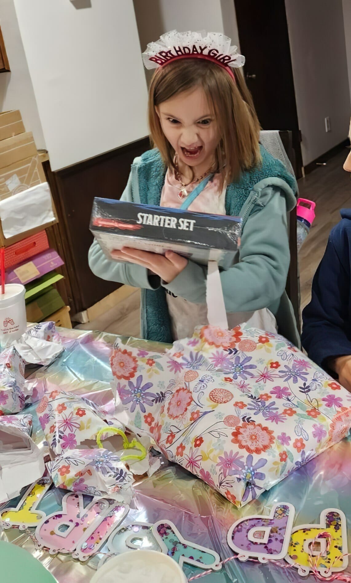 birthday girl unwraps D&D starter set
