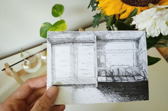 Ghost postcard - colourful flowers in photograph contrasted to black and white illustration