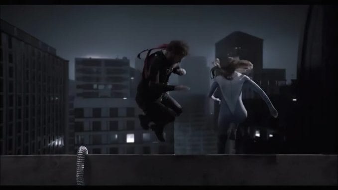 Superheroes jump off building in live action still