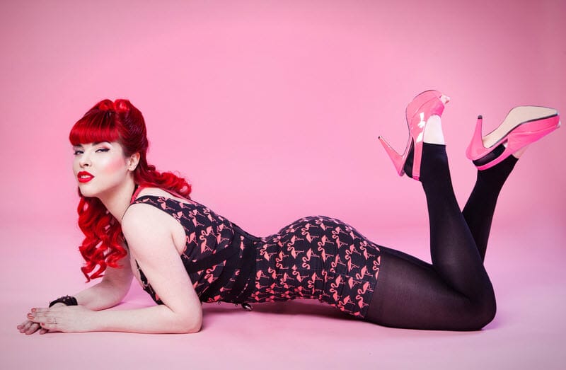 vintage clad model lays on the floor