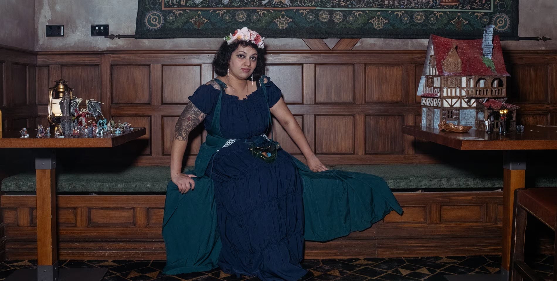 Person between minis and scenery for tabletop